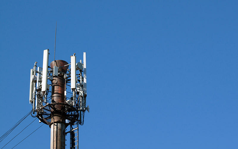 This 2013 photo shows a tower with a cellular telephone antennas and electronic communications equipment.
