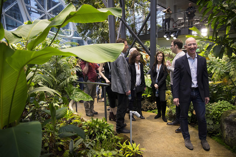 Jeff Bezos laughs while touring The Spheres, which opened on Monday, January 29, 2018, in Seattle.