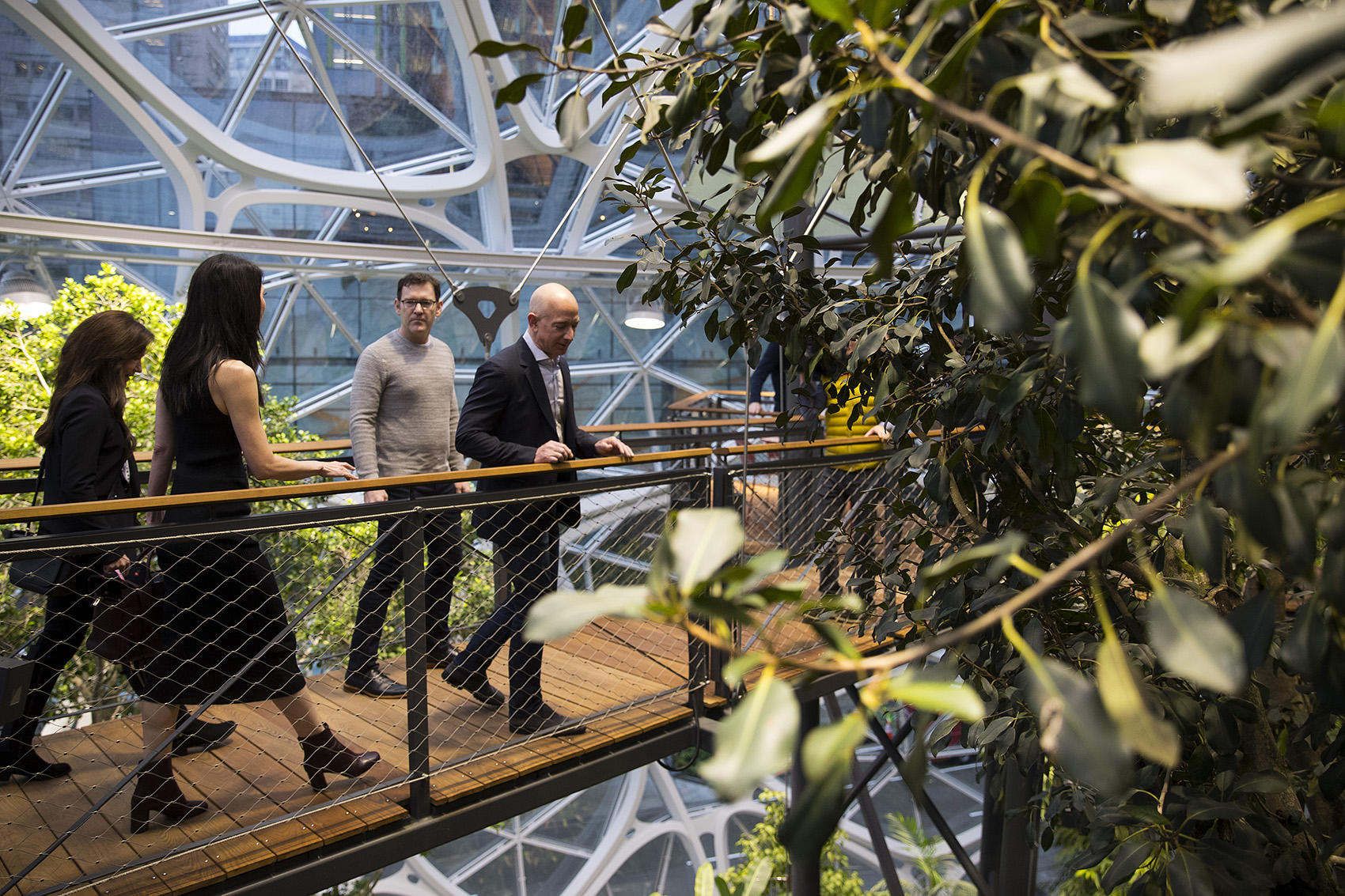Jeff Bezos, right, tours The Spheres on Monday, January 29, 2018, during the grand opening in Seattle.