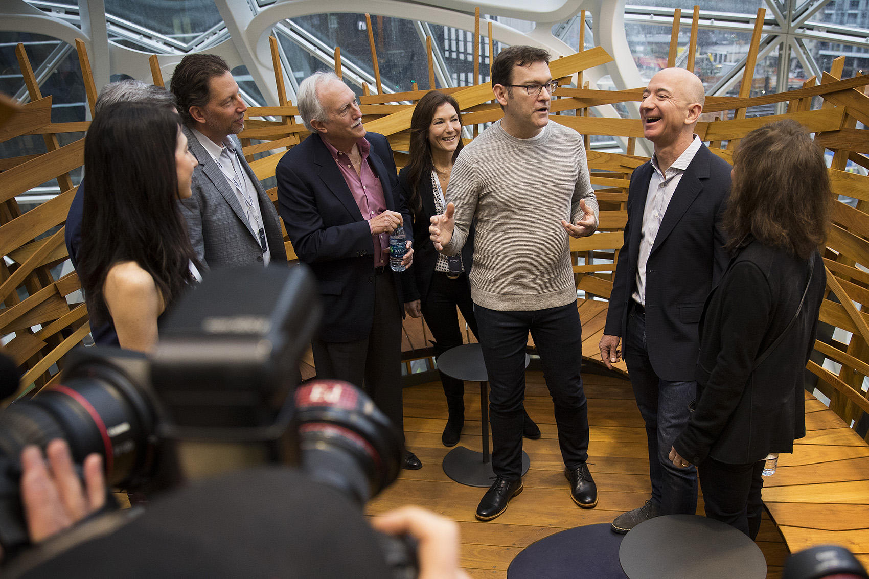 Jeff Bezos, right, laughs while touring the Amazon spheres on Monday, January 29, 2018, during the spheres grand opening in Seattle. 