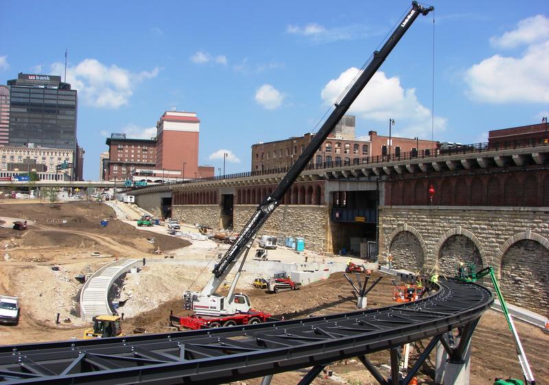 Parking garage gives way to paths and green space below the Arch | St. Louis Public Radio
