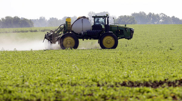 Soybeans are sprayed in Iowa in 2013. Enlist Duo is a mixture of two chemicals that farmers have used separately for many years: glyphosate (also known as Roundup) and 2,4-D. The new formulation is intended to work hand-in-hand with a new generation of corn and soybean seeds that are genetically engineered to tolerate sprays of both herbicides.