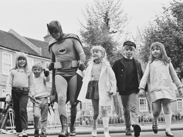 Adam West brings out his alter ego, Batman, for the filming of a 1967 road safety ad for children.
