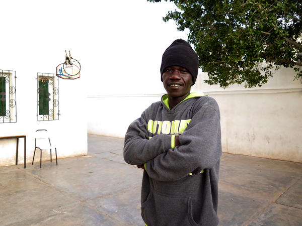 Boubaker Nassou describes the prisons where he was held in Libya as "slave markets." He was repeatedly bought and sold into and out of these prisons before being taken into bonded labour. Now he lives in a shelter run by the Tunisian Red Crescent.