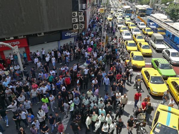 Demonstrators filled the streets of Tehran on Monday to protest economic downtown in Iran.