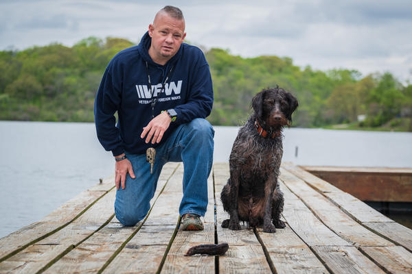 Army veteran Lynn Rolf III, and Boomer, his dog. Rolf was diagnosed with post-traumatic stress disorder after serving in Iraq.