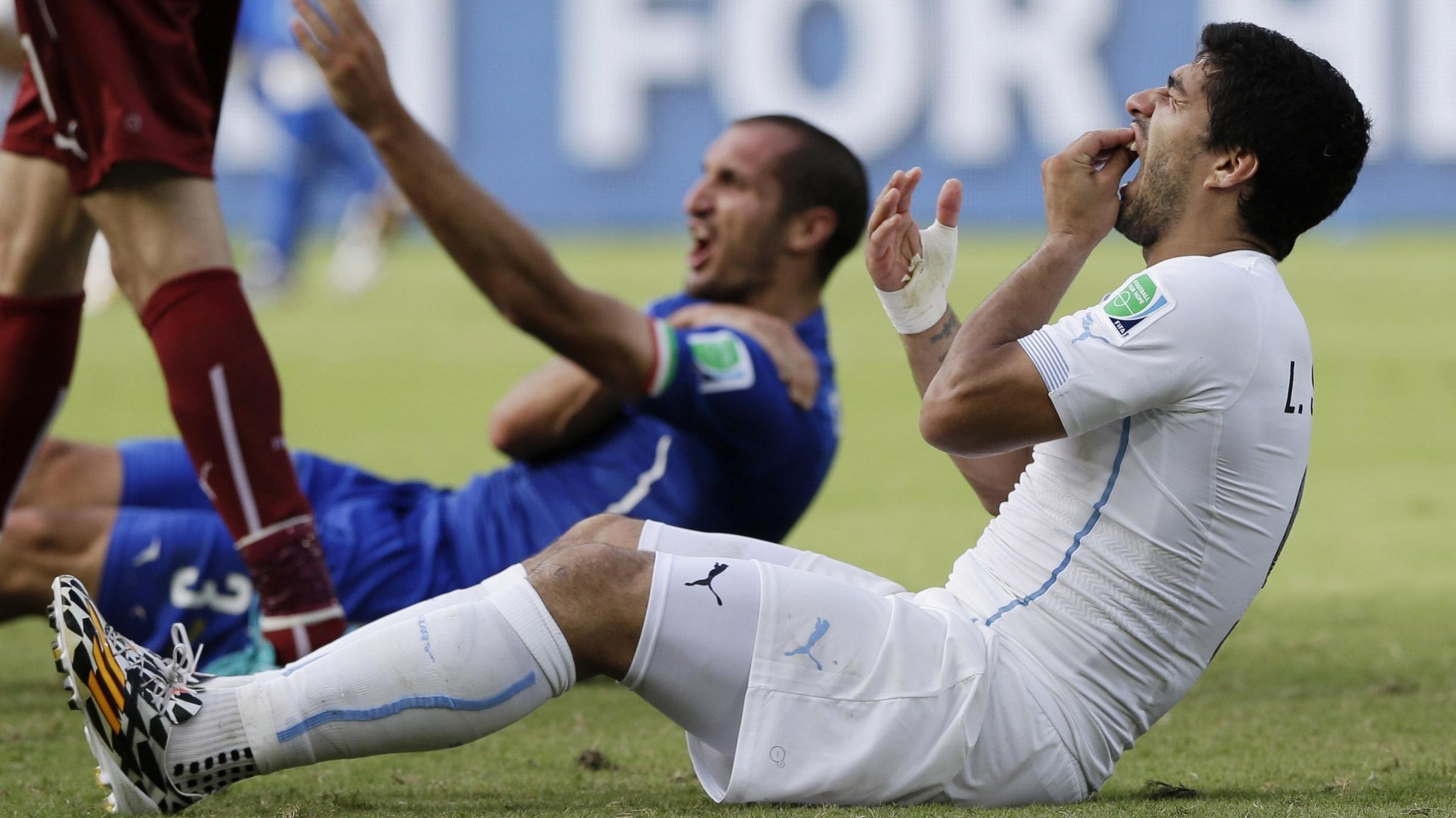 Uruguays Luis Suarez Banned From Remaining World Cup 