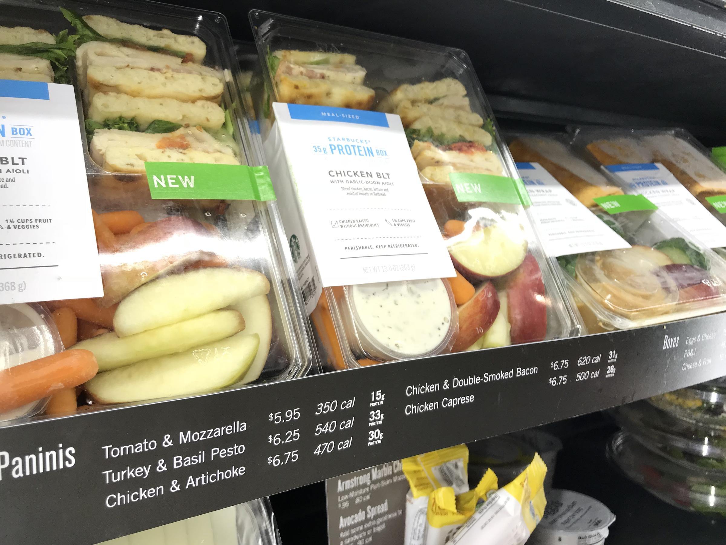 Signs declare the calorie counts for sandwiches and other grab-and-go items...