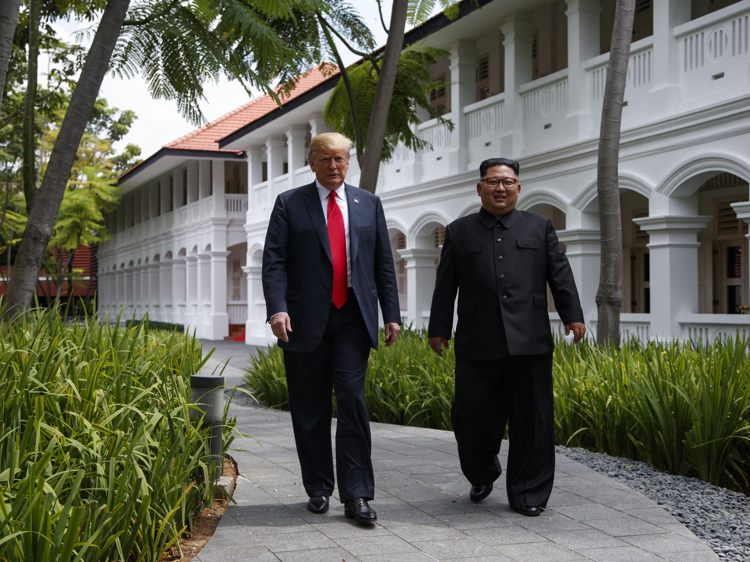 President Donald Trump walks with North Korean leader Kim Jong Un in Singapore in June | www.bpr.org