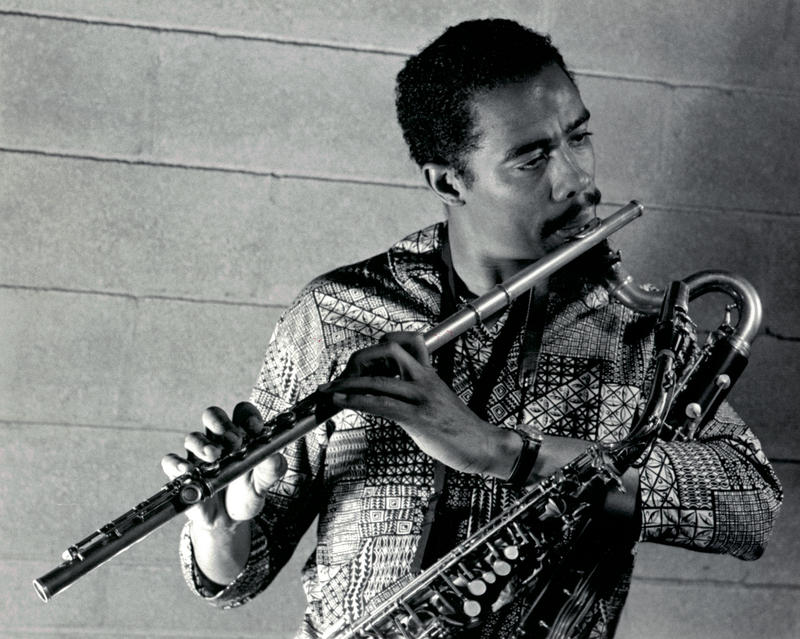 Eric Dolphy with all three of his trademark instruments: flute, alto saxophone and bass clarinet