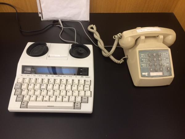 Older communication tools are being replaced by newer technology, but not everywhere. This phone at the library converts text to voice, but many people who are hearing impaired prefer to use a translator through a video phone. 