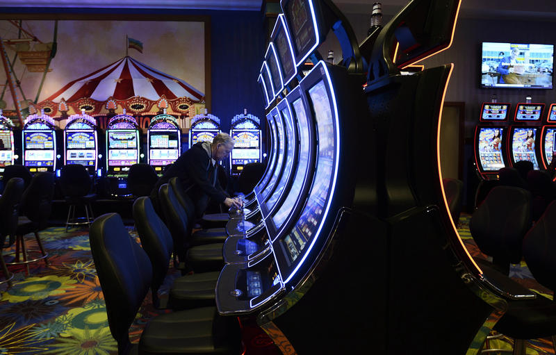 playing slot machine at casino