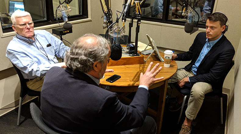 Gavin Jackson (r) speaks with Russ McKinney (l) and Andy Shain in the South Carolina Public Radio studios on Monday, April 30, 2018.
