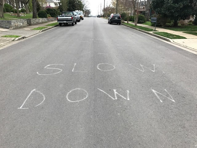 Some neighborhood vigilantes have been trying to slow traffic in whatever ways they can — like painting "slow down" in the street. 