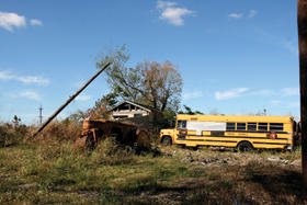 schoolbus and rural setting in disrepair