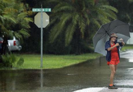 Health Department Testing For Bacteria Along Beaches After Sewage A Woman Takes Photo Of Flooded Streets In The S Acres St Petersburg