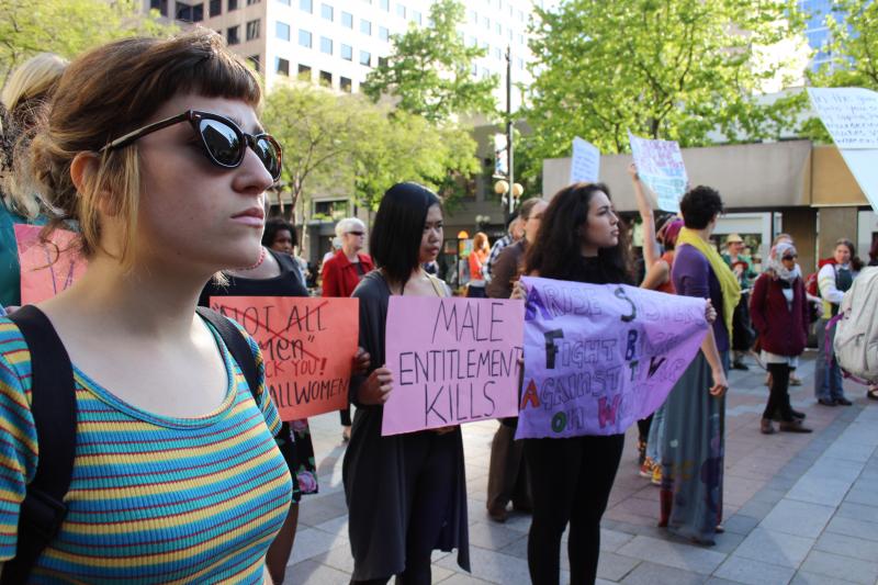 Alia Kusumaningrat, center, attended the #yesallwomen rally on Friday with friends from Seattle Central College. For Kusumaningrat, 18, the rally was part of finding words to describe the subtleties of sexism.