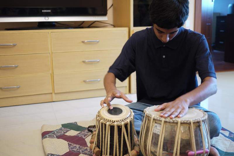 Apurva Koti, 16, plays tabla drums in his living room in Hyderabad, India.  Apurva also plays electric guitar. Apurva and his family moved to India from Redmond, Washington in 2008. 