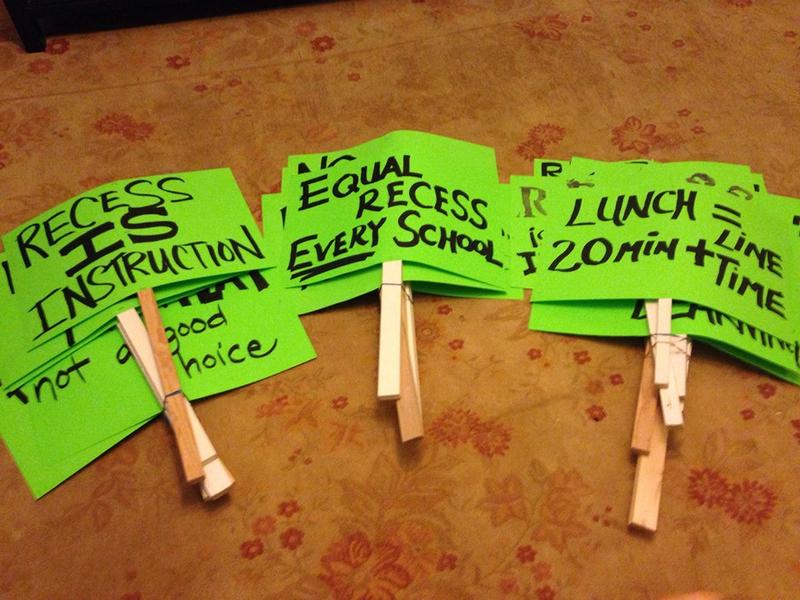 Signs promote lunch and recess for Seattle students.