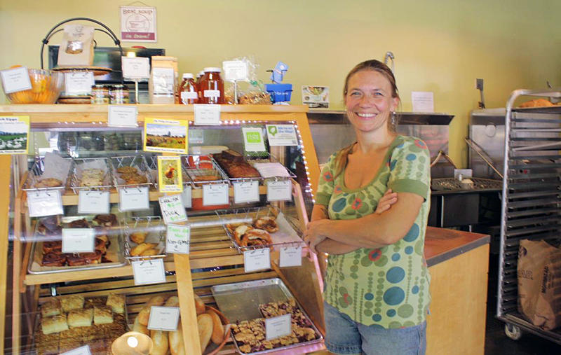 Annette Heide-Jessen's Kaffeeklatsch coffee shop has bet on Lake City Way. A big garage door opens right onto the state highway, which doubles as Lake City's 'main street.' Heide-Jessen sees Lake City as 'the next Columbia City.'