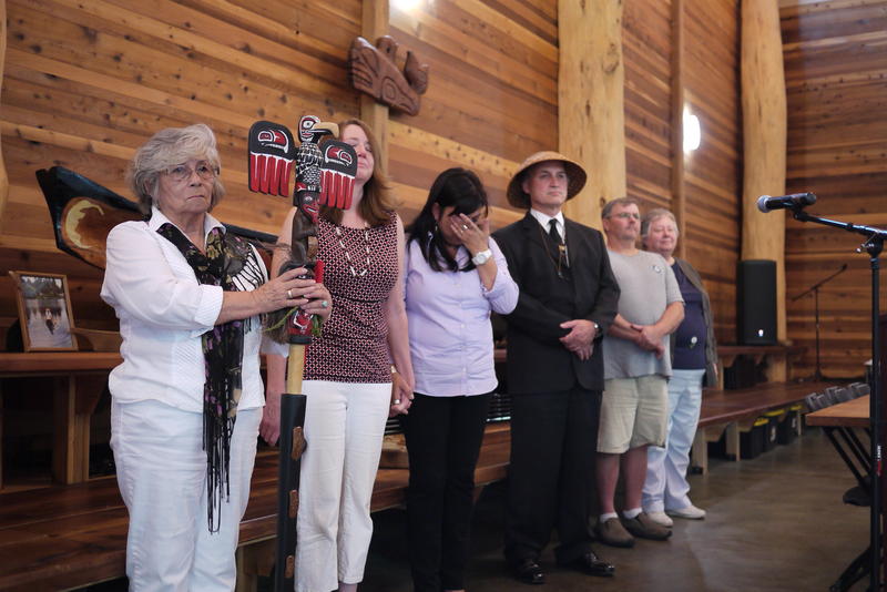 Duwamish Chairwoman Cecile Hansen, left, stands with family and supporters at the tribe's longhouse.