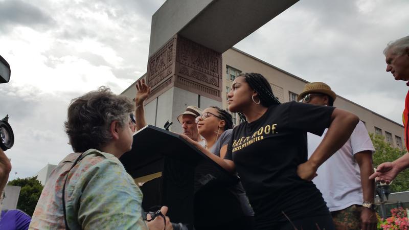 Activists from the Seattle chapter of Black Lives Matter took over the stage at a rally for Vermont Sen. Bernie Sanders on Sat., Aug 8, 2015. They called for four minutes of silence, and Sanders left the stage to greet those who had come to see him. 