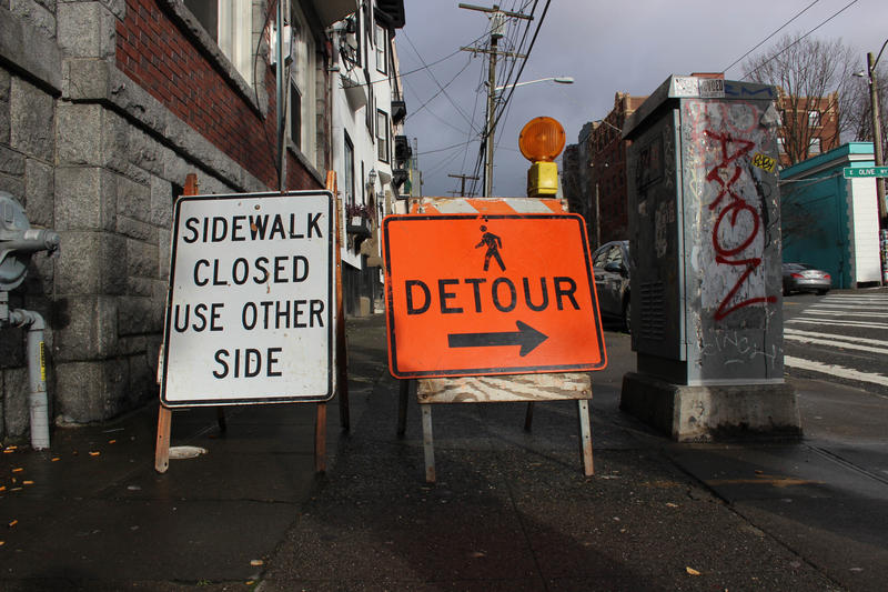 Mark Adreon took KUOW on a walk through Capitol Hill to demonstrate how hard it is being blind and navigating the endless construction sites in the city. When he arrived at this spot, the placards through him off course.