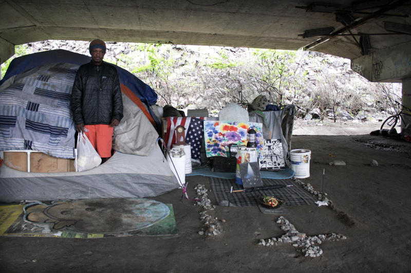 Some residents of the Jungle keep tidy encampments, like William Kowang above, while others live in garbage with needles strewn about.