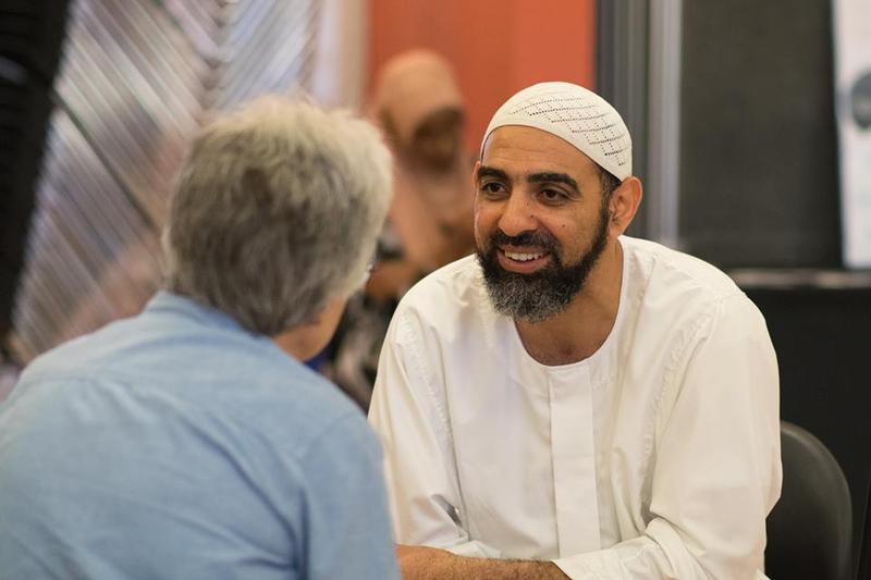 Mohamed Bakr talks with Glenda Johnson (left) at KUOW's Ask a Muslim event on July 24, 2016 at the New Holly Gathering Hall.