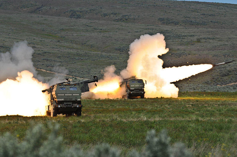 Soldiers fire two rounds from their High Mobility Artillery Rocket systems at Yakima Training Center in 2011.