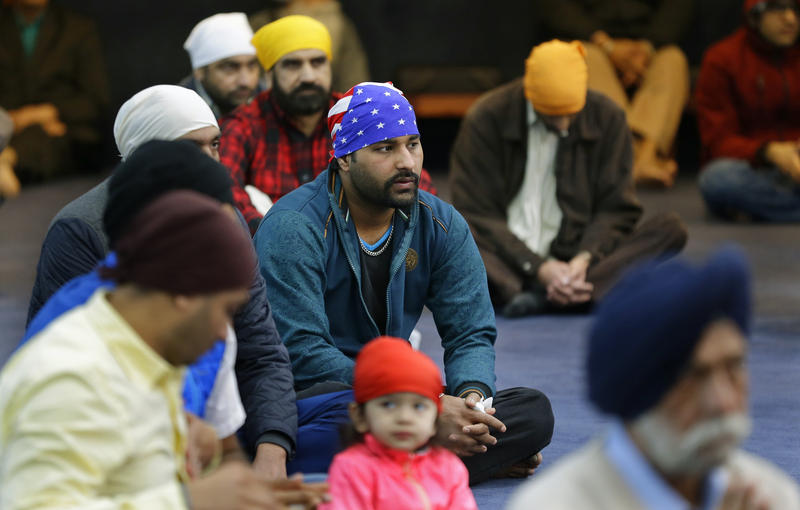 Men attend Sunday services at the Gurudwara Singh Sabha of Washington, a Sikh temple in Renton, Wash., Sunday, March 5, 2017, south of Seattle.