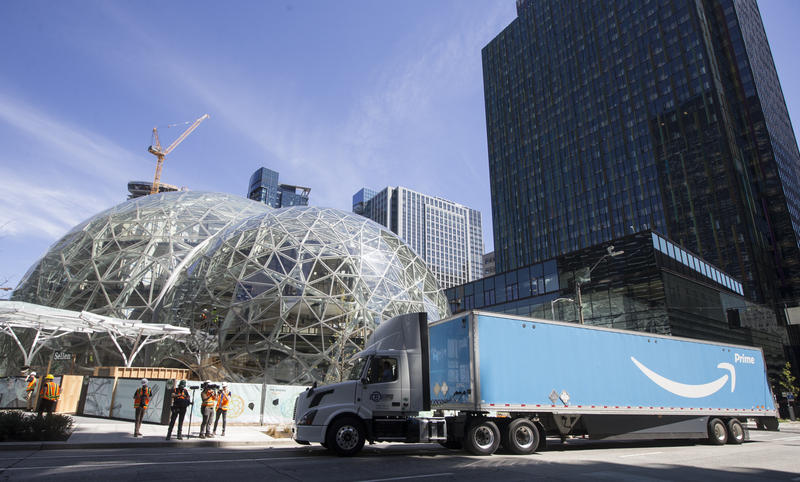 An Amazon Prime truck delivers an Australian fern to Amazon's campus for the ceremonial first planting at The Spheres on Thursday,  May 4, 2017, in Seattle.