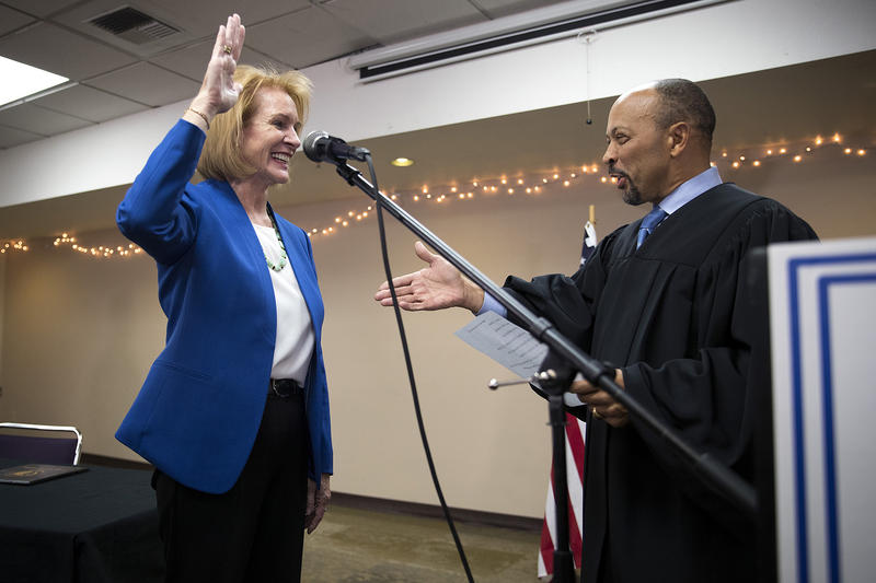 Seattle mayor Jenny Durkan takes the oath of office, administered by U.S. District Court Judge Richard Jones, right, on Tuesday, November 28, 2017, at the Ethiopian Community Center in Seattle. 