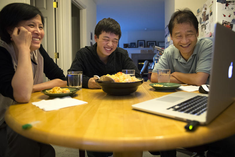 The author (middle) with his mother, Guoping Ma (left), and his father, Siyuan Liu. Here they Skype over dinner with family in Tianjin, China.