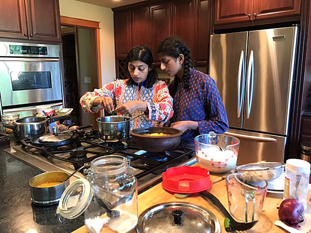 Neelima Musaliar (L) learned to cook as a prerequisite for an arranged marriage. Now she's teaching her daughter Aliyah (R) to cook to show her that she doesn't need to stir the pot for anyone other than herself. 