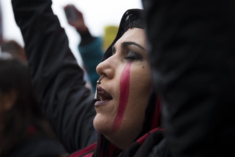 Raven Healing sings with Missing and Murdered Indigenous Women of Washington group members during the Women's March on Saturday, January 20, 2018, on Pine St., in Seattle.