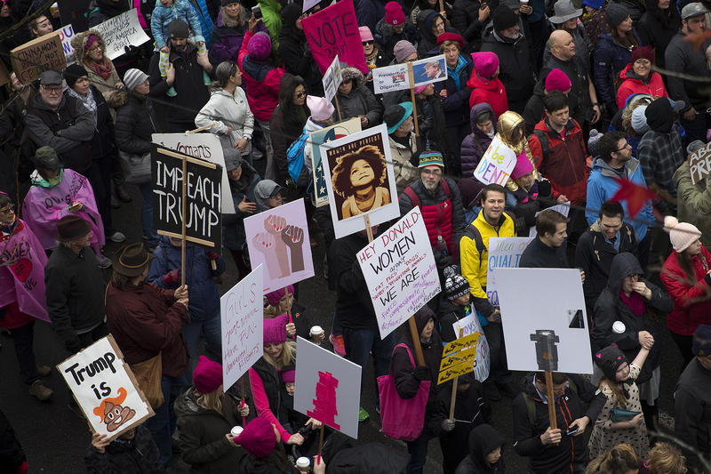 Thousands march on Pine St., during the beginning of the Women's March on Saturday, January 20, 2018, in Seattle. 