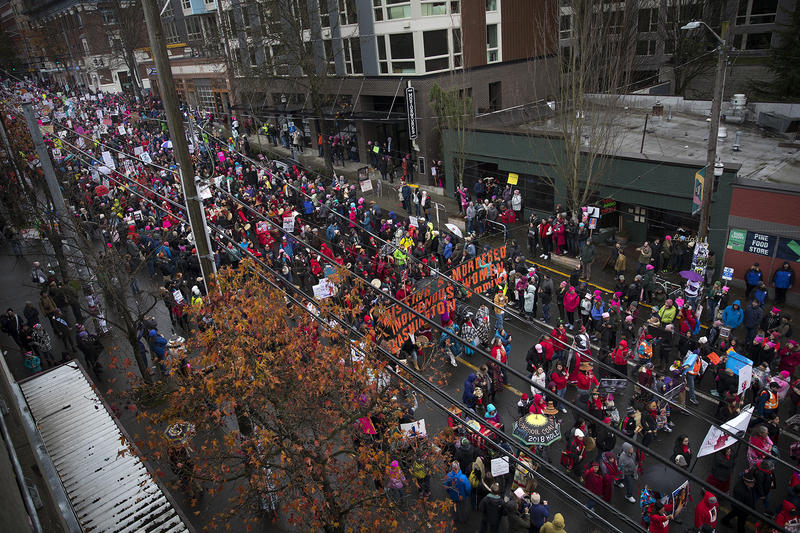 Thousands march on Pine St., during the beginning of the Women's March on Saturday, January 20, 2018, in Seattle. 