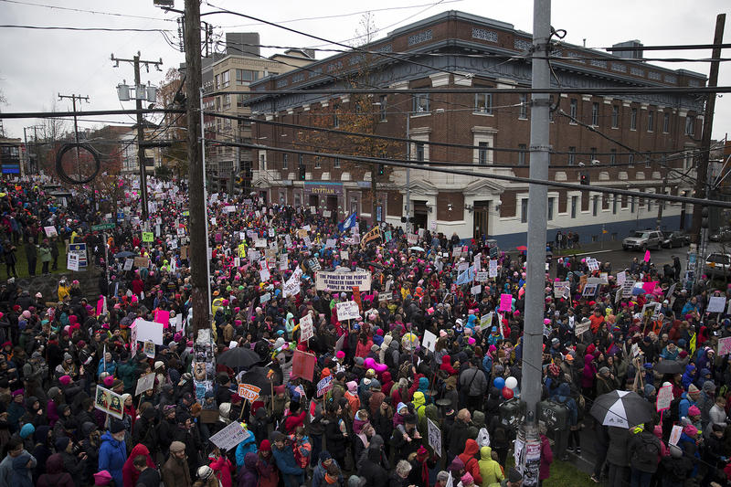 Thousands march on Pine St., during the beginning of the Women's March on Saturday, January 20, 2018, in Seattle. 