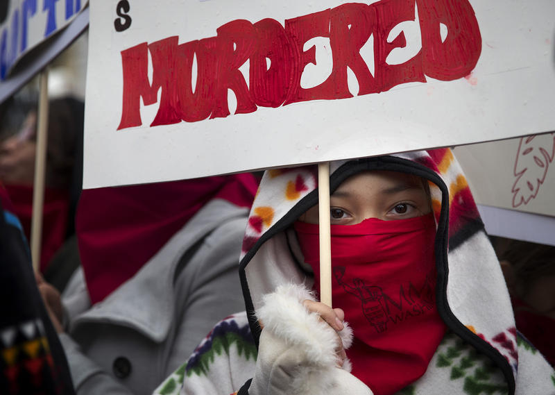 Denae Shippentower, 11, of the Puyallup Tribe stands with other members of the Missing and Murdered Indigenous Women of Washington group before the start of the Women's March on Saturday, January 20, 2018, in Seattle. 