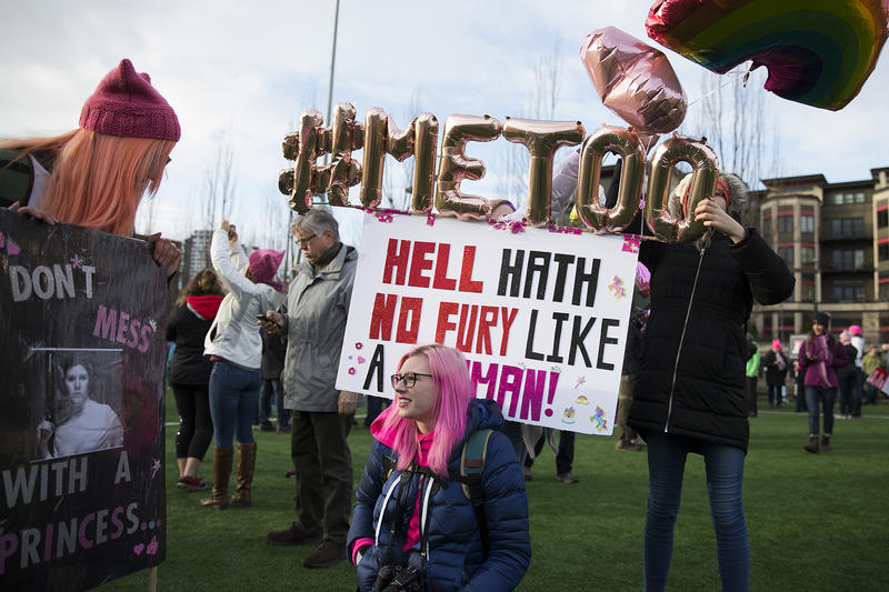 Holly Tyra adjusts her balloons before the start of the Women's March rally at Cal Anderson Park on Saturday, January 20, 2018, in Seattle. 