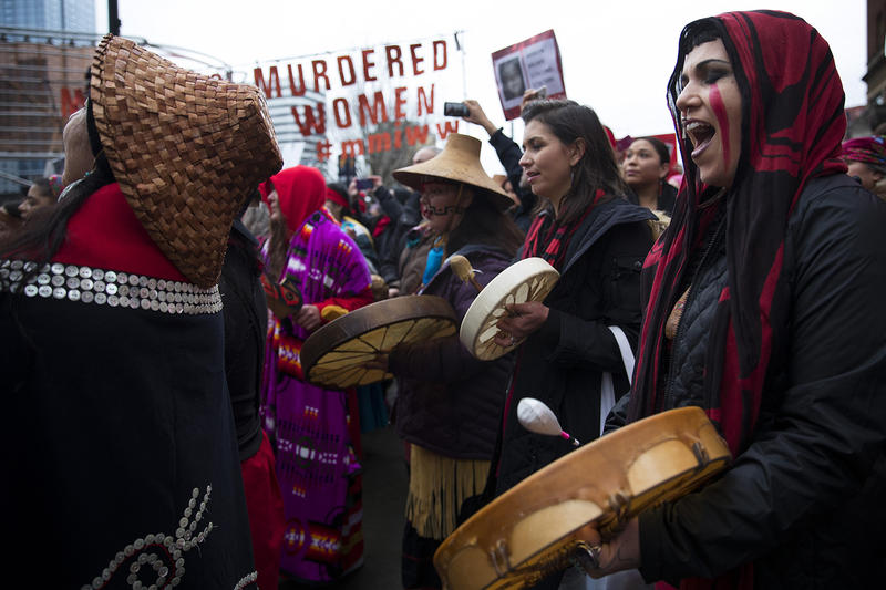 Raven Healing sings with Missing and Murdered Indigenous Women of Washington group members during the Women's March on Saturday, January 20, 2018, on Pine St., in Seattle.