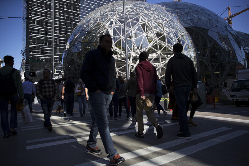 Pedestrians cross the street at Amazon headquarters in Seattle in September. 