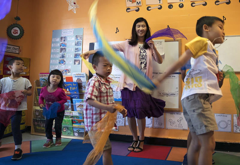 Seattle Preschool Program teacher Hien Do, center, dances with her students on Wednesday, June 28, 2017, at the ReWA Early Learning Center at Beacon, in Seattle, Washington. 