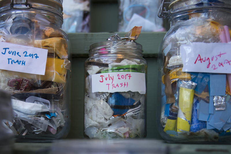 Jars filled with the garbage that Deb Seymour has accumulated over each month of 2017 are shown at her home on Wednesday, December 20, 2017, in Seattle. 