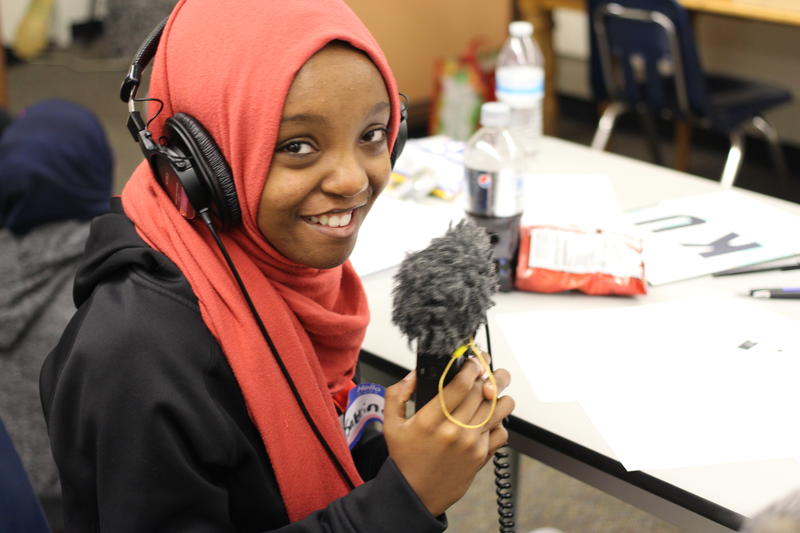 Sabrina Abdullahi from the Coalition for Refugees from Burma practices using a recorder.