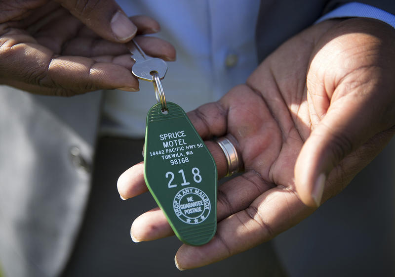 De'Sean Quinn shows his prized possession: the key to one of the motels that used to dominate Tukwila's stretch of the old highway 99.
