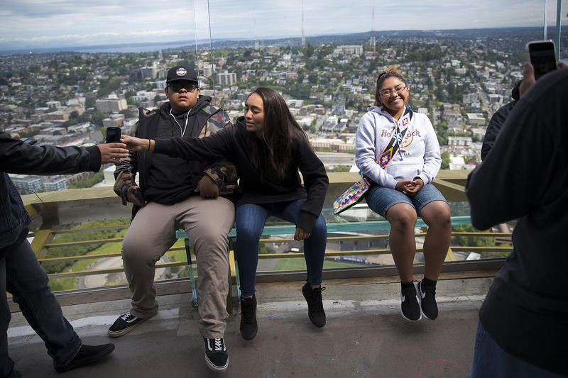 Neesah Kanip, right, has her picture taken on the observation deck on Tuesday, June 5, 2018, at the Space Needle in Seattle.