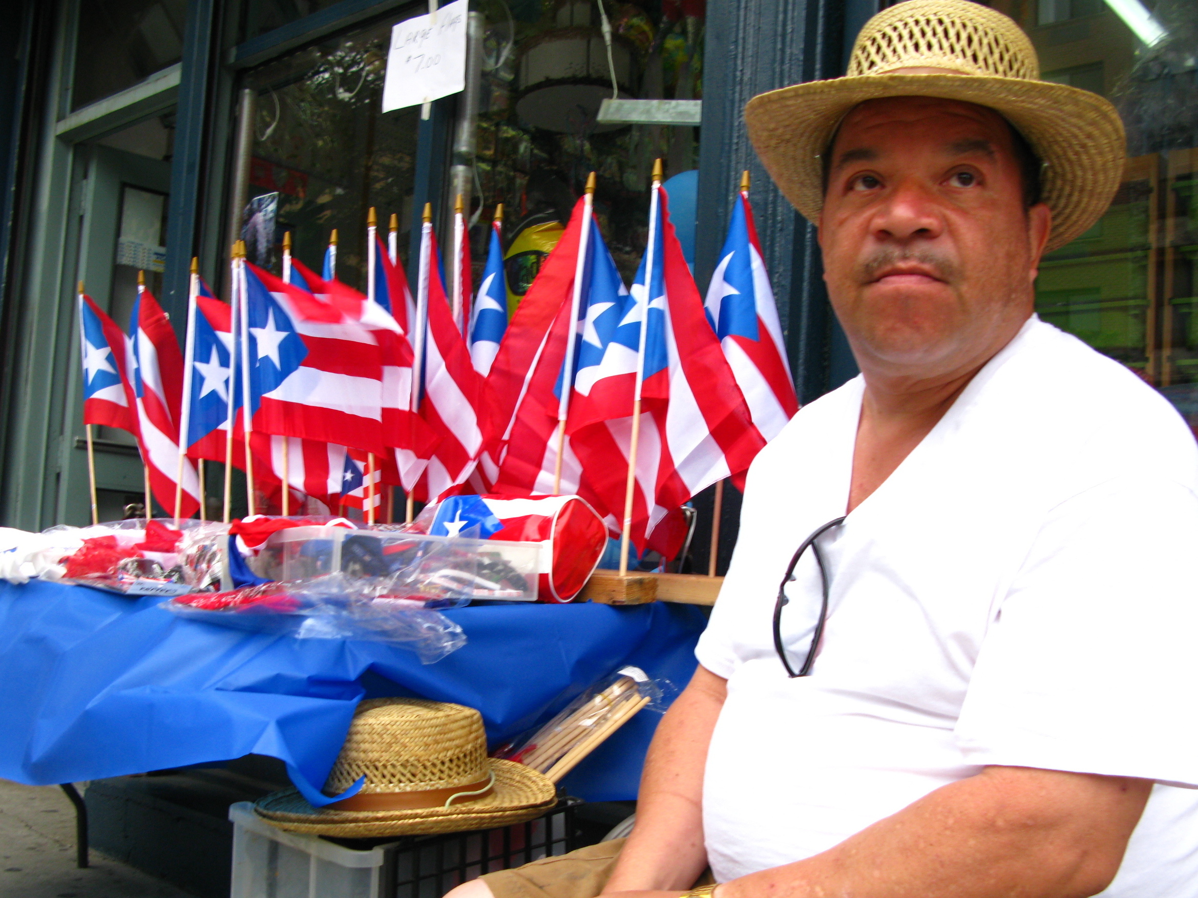 Puerto Rican Flags Wave To New York's Parade-Goers.