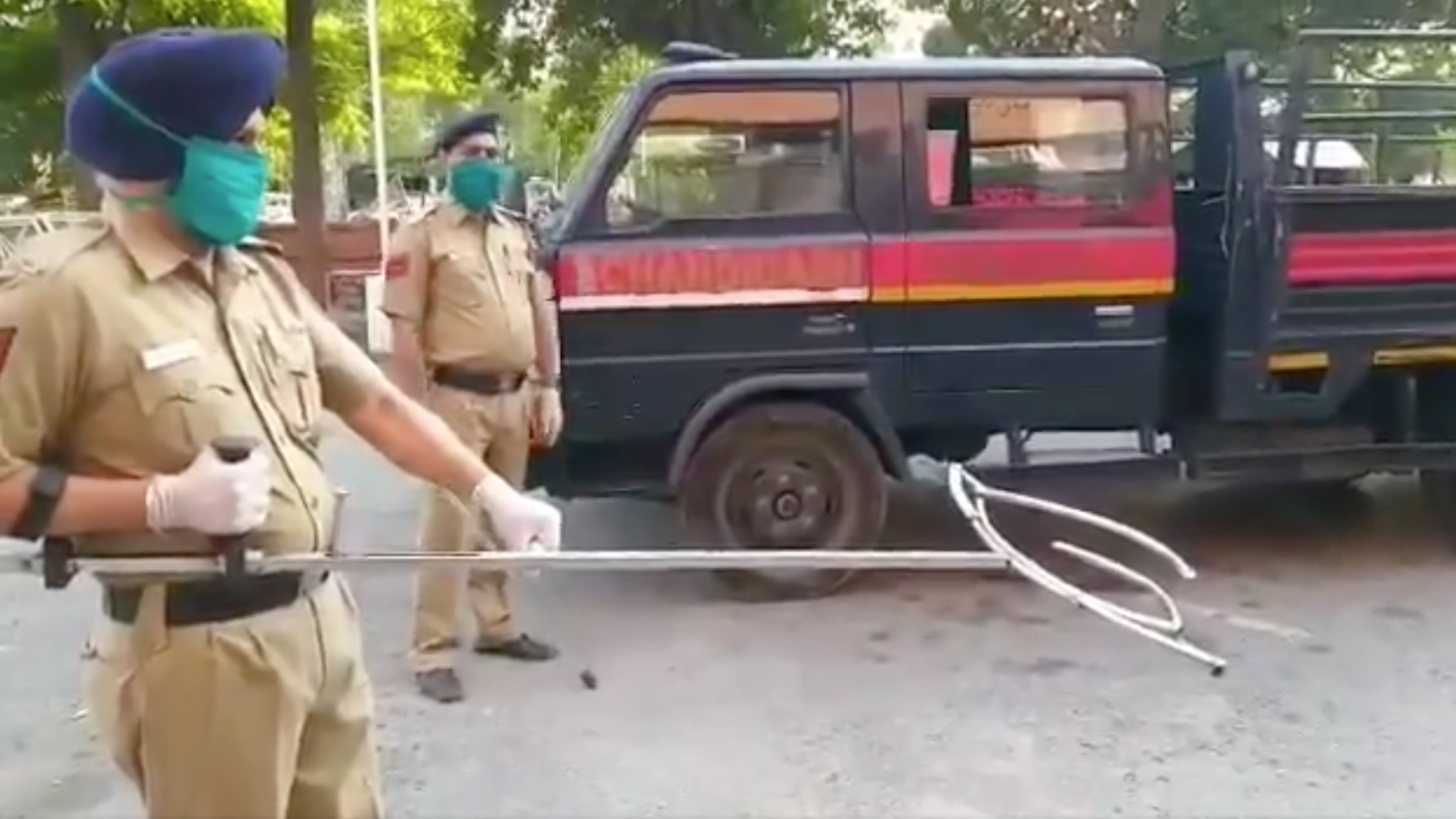 how to nab suspects while social distancing indian police try giant tongs wbfo indian police try giant tongs